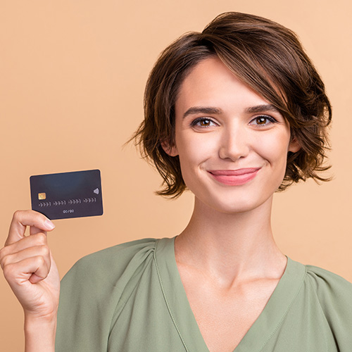 Woman holding debit card